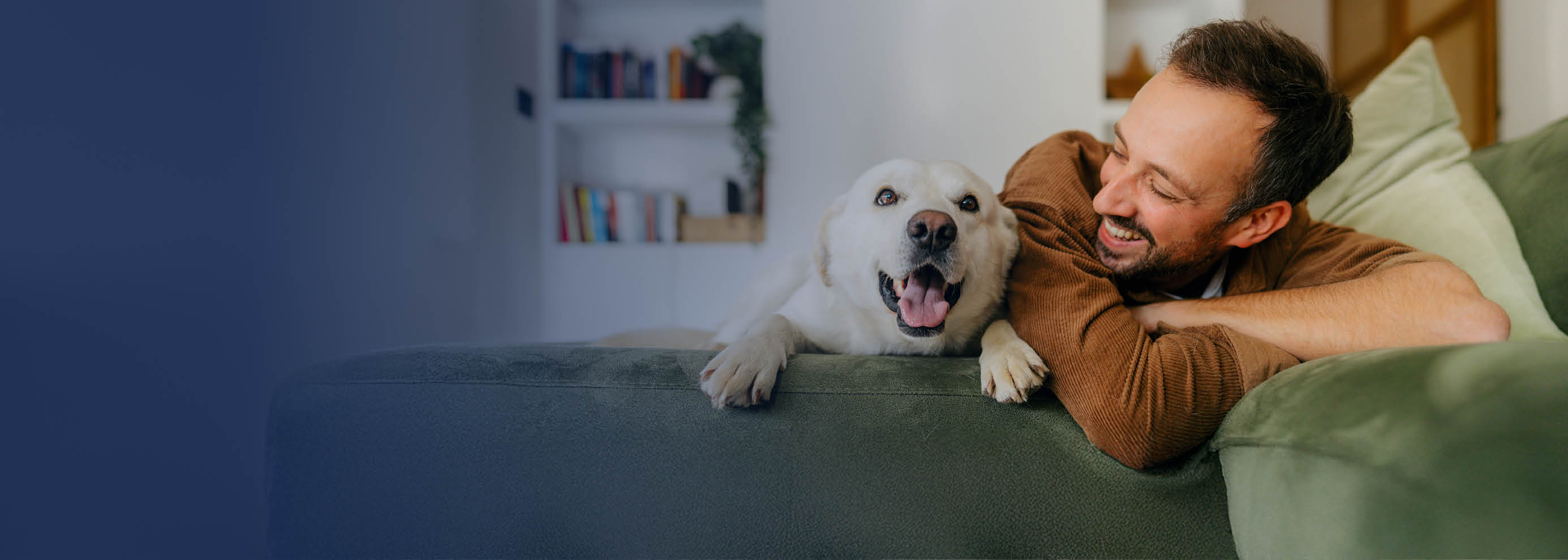 Man on couch with his dog.