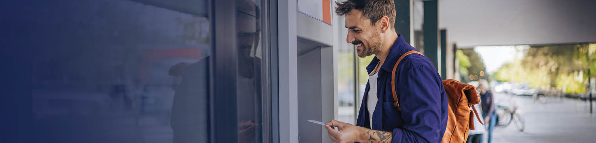 Man using an ATM.