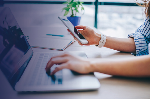Close up of computer and phone