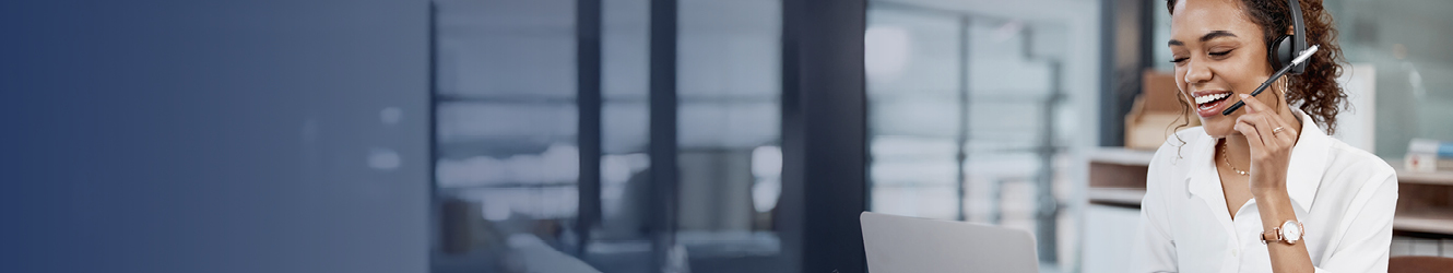 Woman using headset to speak on phone.